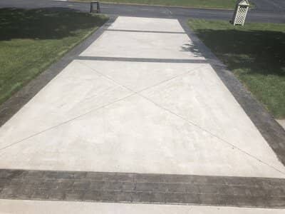Concrete driveway with decorative stamped concrete edge